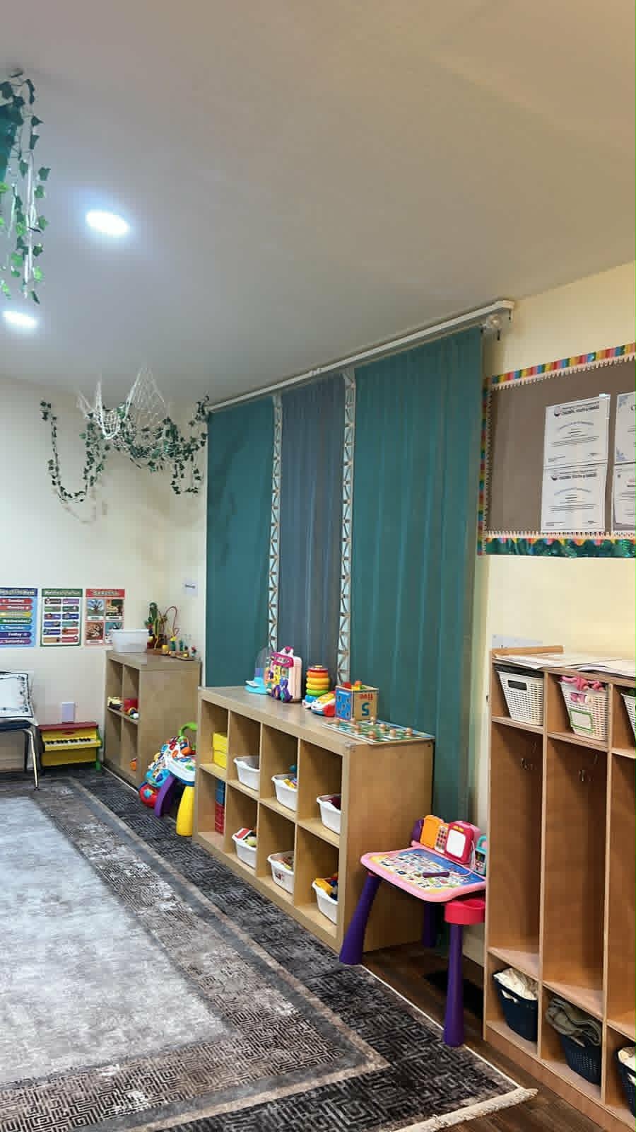 Caring teacher and child learning together at WonderWorld Kids