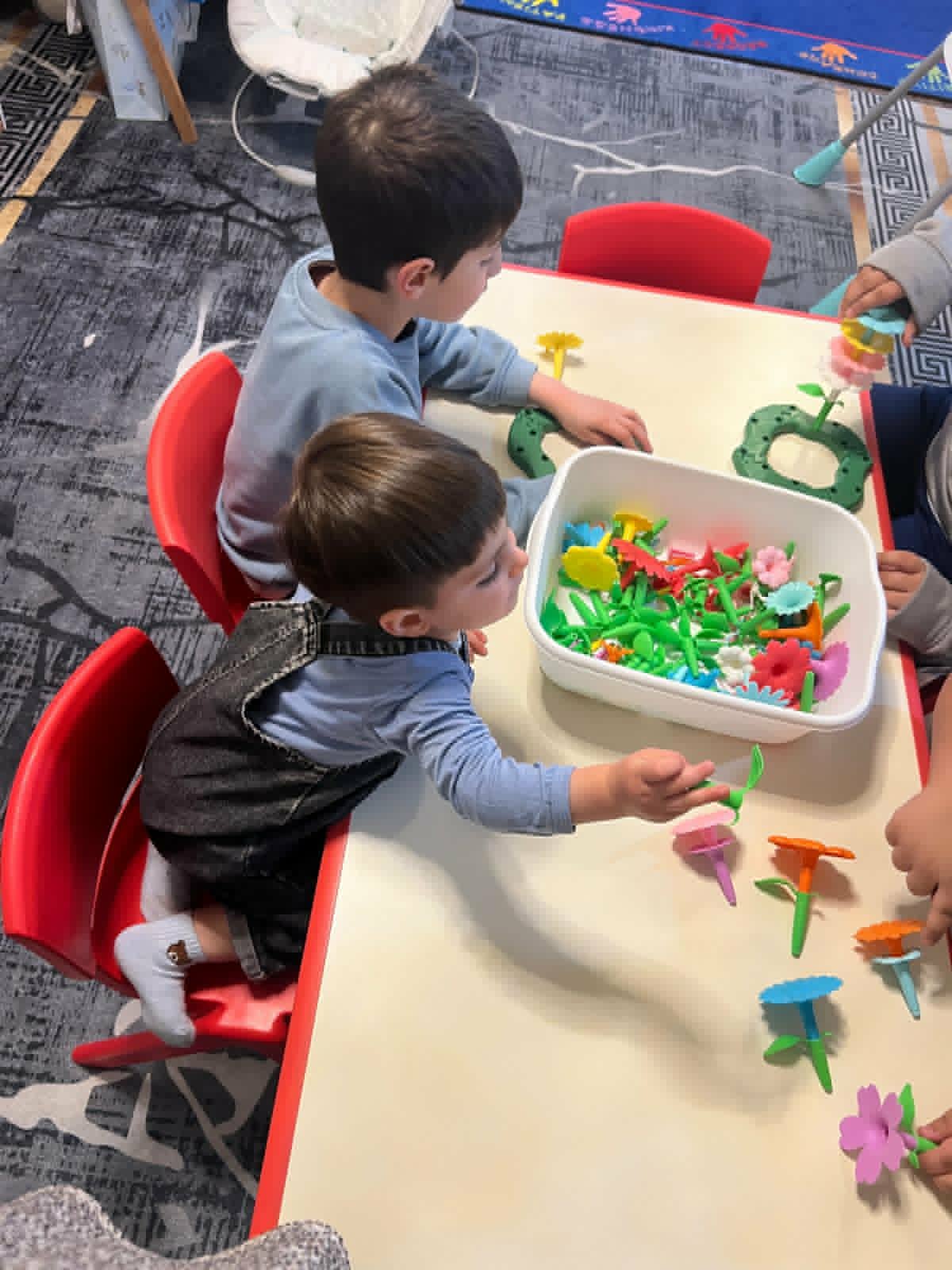Kids playing with flower building toys at the activity table