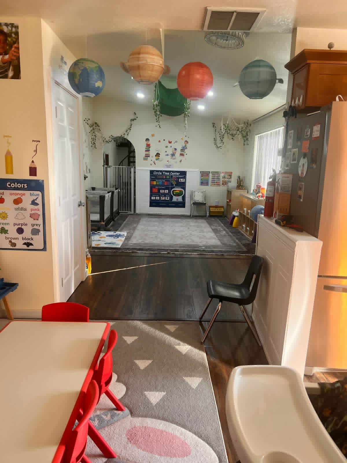 Circle time area with planet decorations at WonderWorld Kids